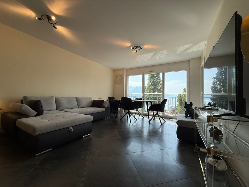 Spacious living room with lake view in apartment for sale on Grand Rue 54, Montreux, Switzerland